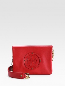 The iconic Tory logo adds a signature touch to this sleek leather bag finished with a chic chain strap.Shoulder strap,15 drop Magnetic flap closure Two zip-compartments Cotton lining with logo 8½W X 6H X 1D Imported