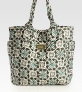 A whimsical print covers this carryall of sturdy nylon, with signature letter stitching and dual side pockets. Double top handles, 7 dropMagnetic snap closureTwo outside open pocketsOne inside zip pocketTwo inside open pocketsLogo-printed lining13W X 13½H X 4½DImported