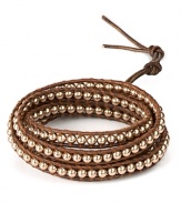 Take your wrist in a bohemian direction with Chan Luu's textured wrap bracelet. Embellished with light-reflecting pearls, this leather piece is perfect for layering.