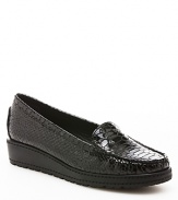 Stuart Weitzman gives driving loafer styling a lift on wedge soles, in a look that's elevated yet comfortable.