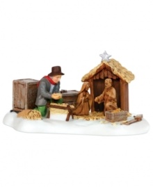 A calming hush falls upon this scene as a festively dressed man lovingly and tenderly prepares the manger of his New England village's nativity. This porcelain figurine captures the anticipation, excitement and reverence of the holiday season. A calming hush falls upon this scene as a festively dressed man lovingly and tenderly prepares the manger of his New England village's nativity. This porcelain figurine captures the anticipation, excitement and reverence of the holiday season.