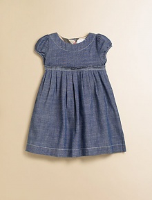 A captivating frock in soft chambray, with a crisply pleated Empire waist and sweet puffed sleeves.Round neckline with topstitchingShort puffed sleevesEmpire waist with stitched pleatsFull button back with check trimCottonMachine washImported Please note: Number of buttons may vary depending on size ordered. A captivating frock in soft chambray, with a crisply pleated Empire waist and sweet puffed sleeves.Round neckline with topstitchingShort puffed sleevesEmpire waist with stitched pleatsFull button back with check trimCottonMachine washImported Please note: Number of buttons may vary depending on size ordered.