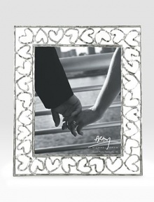 Finding inspiration from the imagery that floats around classic storytelling, this charming frame is crafted from hand-forged, nickel-plated metal by one of America's premier metalwork artists. From the Heart CollectionOverall, 11¾ X 14Accommodates a 8 X 10 photographArrives in a gift box for giving or storingImported Finding inspiration from the imagery that floats around classic storytelling, this charming frame is crafted from hand-forged, nickel-plated metal by one of America's premier metalwork artists. From the Heart CollectionOverall, 11¾ X 14Accommodates a 8 X 10 photographArrives in a gift box for giving or storingImported