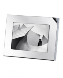 The Ambiray large picture frame from Swarovski presents sleek, stainless steel heightened with dozens of tiny faceted clear crystals along its edge, creating a home accent that truly radiates glamour and sophistication. The Ambiray large picture frame from Swarovski presents sleek, stainless steel heightened with dozens of tiny faceted clear crystals along its edge, creating a home accent that truly radiates glamour and sophistication.
