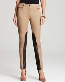 Bullish leather insets lend modern attitude to these skinny Jones New York Collection trousers. Team with nude heels for a striking silhouette.