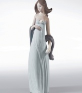 A vision of beauty, this handcrafted figurine from Lladró casts a spell in any room. Stands 13.5 tall.