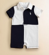 This classic rugby design with bold colorblocking features signature pony embroidery for an authentic polo touch.Ribbed polo collarShort sleevesHidden front button placketBottom snapsCottonMachine washImported Please note: Number of buttons and snaps may vary depending on size ordered. 