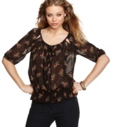 GUESS? updates the peasant blouse with demure cutouts and a pretty floral print! Dress this top with your favorite skinnies for a casual day look that holds it's own!