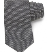 Carefully woven for a handsome check design, this premier tie from Armani Collezioni is made from lavish Italian silk for a luxurious addition to your wardrobe.