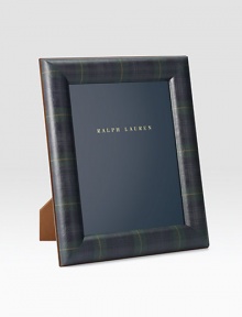 An elegant display for a cherished photo, rendered in supple saddle leather with a nickel-plated brass finish. Holds one 10 X 13 photoLeather and nickel-plated brassImported An elegant display for a cherished photo, rendered in supple saddle leather with a nickel-plated brass finish. Holds one 10 X 13 photoLeather and nickel-plated brassImported