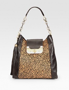 A beautiful leopard print hair calf panel with supple leather sides in a roomy carryall design.Leather and chain shoulder strap, 9 dropTurnlock strap closureDetachable tassel accentTwo outside open pockets, one under strap and one on backOne inside zip pocketTwo inside open pocketsOne pen holderFully lined13W X 12¾H X 4DImported
