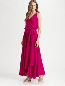 Finished with a floor-sweeping ruffle hem, this silk halter design has a crossover v-neck and flattering self tie that concludes with a bow. Crossover v-neckHalter tiesSelf tie at waistAsymmetrical ruffle hemAbout 42 from natural waistSilkDry cleanMade in USAModel shown is 5'10 (177cm) wearing US size Small. Finished with a floor-sweeping ruffle hem, this silk halter design has a crossover v-neck and flattering self tie that concludes with a bow. Crossover v-neckHalter tiesSelf tie at waistAsymmetrical ruffle hemAbout 42 from natural waistSilkDry cleanMade in USAModel shown is 5'10 (177cm) wearing US size Small.