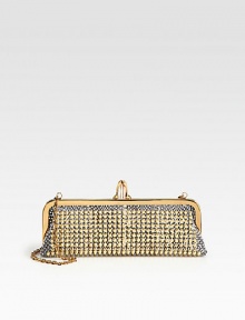 Luxurious python accented in theatrical studs with signature hardware.Concealable chain shoulder strap, 11 dropTop clasp closureOne inside open pocketSignature red lining10½W X 3H X 1½DMade in Italy