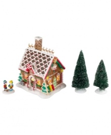 The children of North Pole Village find all the supplies and inspiration they need for new gingerbread houses at Mrs. Claus' Baking Supplies shop. Peppermint spirals, rainbow sprinkles and frosted white accents make it a favorite destination. Two snow-dusted trees complete the scene. The children of North Pole Village find all the supplies and inspiration they need for new gingerbread houses at Mrs. Claus' Baking Supplies shop. Peppermint spirals, rainbow sprinkles and frosted white accents make it a favorite destination. Two snow-dusted trees complete the scene.
