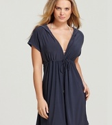 A hooded silhouette lends a sporty look to a Magicsuit swim coverup.