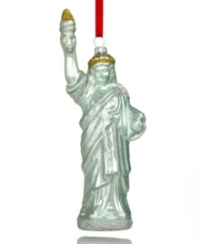Take a piece of the big city wherever you're headed this holiday with a molded glass ornament depicting New York's Statue of Liberty. Take a piece of the big city wherever you're headed this holiday with a molded glass ornament depicting New York's Statue of Liberty.