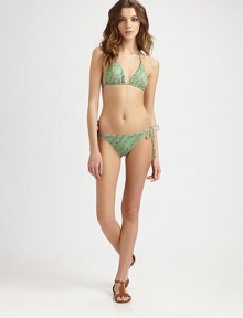 A playful swim design offering a phenomenal fit, thanks to adjustable triangle cups and just the right amount of stretch. Halter strap ties at neckTriangle cupsBack tie closureFully lined80% polyamide/20% elastaneHand washImported of Italian fabric Please note: Bikini bottom sold separately. 
