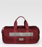 Grab and go to the gym or for an extended weekend getaway, with this sturdy nylon duffel.Zip closureTop handlesAttached shoulder strapInterior zip pocketThree interior slip compartmentsFully linedNylon20½W x 12½H x 10½DImported