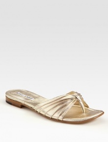 Pleated, metallic leather upper with a thong front and comfortable padded insole. Metallic nappa leather upperLeather liningBuffed leather solePadded insoleMade in ItalyOUR FIT MODEL RECOMMENDS ordering true size. 