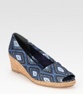 Braided leather wedge and platform defined by a soft, tribal-print linen upper. Braided leather wedge, 2 (50mm)Braided leather platform, ½ (15mm)Compares to a 1½ heel (40mm)Printed linen upperLinen liningLeather solePadded insoleImportedOUR FIT MODEL RECOMMENDS ordering true size. 