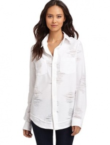 THE LOOKPoint collarButton frontDistressed and frayed details throughoutDual chest patch pocketsLong sleeves with button cuffsTHE FITAbout 29 from shoulder to hemTHE MATERIALCotton/polyester/spandexCARE & ORIGINMachine washMade in USAModel shown is 5'8 (172½cm) wearing US size Small. 