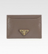 Saffiano vernice leather in a flat compact design.Two open pocketsFully lined4W X 2¾H X ¼DMade in Italy