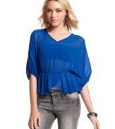 Sheer chiffon fabric and a flirty, tulip hem makes this dolman-sleeve top from Miss Chievous a total dream.