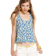 Slip into cute, summery design with this floral print top from Material Girl! Features a scalloped hem and fun cutout style at the back!