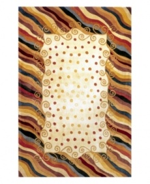 A polka dot pattern against a subtle creme background creates an abstract rug of rich, artistic beauty. A vivid, swirling border in a color palette that includes beige, burgundy, lavender and beige completes the rug with a resplendent finish. Hand-tufted and hand-carved of plush wool.