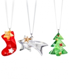 Triple the trim. Stocking, comet and tree ornaments glitter softly in Swarovski crystal crafted in the cheeriest colors of the season. Triple the trim. Stocking, comet and tree ornaments glitter softly in Swarovski crystal crafted in the cheeriest colors of the season.