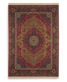 Inspired by the distinctive and beautiful textiles of the Kirman region in ancient Persia, this rug features a curvilinear medallion design upon a field embellished with arabesques and floral motifs. Patterned after a nineteenth-century Kirman rug, it makes use of borders to showcase a spectrum of colors such as indigo blue, brick reds, tobacco golds, browns and olives - with a smattering of soft aqua, coral and burgundy. Each color is specially dyed for a timeworn striated effect that recreates the antique beauty of the original. Woven in the USA of luxuriously soft premium worsted New Zealand wool. Inspired by the distinctive and beautiful textiles of the Kirman region in ancient Persia, this rug features a curvilinear medallion design upon a field embellished with arabesques and floral motifs. Patterned after a nineteenth-century Kirman rug, it makes use of borders to showcase a spectrum of colors such as indigo blue, brick reds, tobacco golds, browns and olives - with a smattering of soft aqua, coral and burgundy. Each color is specially dyed for a timeworn striated effect that recreates the antique beauty of the original. Woven in the USA of luxuriously soft premium worsted New Zealand wool.
