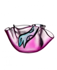 A friendly face slithers in between the folds of magenta-colored glass in this handcrafted Happy Going bowl, a fun surprise for modern interiors. Designed by Ulrica Hydman-Vallien for Kosta Boda. A friendly face slithers in between the folds of magenta-colored glass in this handcrafted Happy Going bowl, a fun surprise for modern interiors. Designed by Ulrica Hydman-Vallien for Kosta Boda.