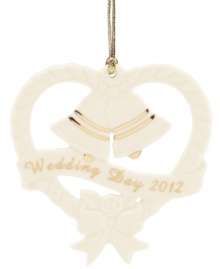 Anticipate a year when wedding and jingle bells will ring with this elegant ornament from Lenox. Sculpted ivory porcelain is dated and detailed in polished gold. Anticipate a year when wedding and jingle bells will ring with this elegant ornament from Lenox. Sculpted ivory porcelain is dated and detailed in polished gold.