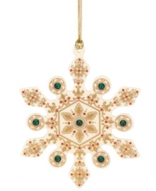 A traditional snowflake gets a makeover in this beautiful ornament from Lenox. Features an ornate gold design with emerald accents for a touch of glimmer. With gold hanging thread. A traditional snowflake gets a makeover in this beautiful ornament from Lenox. Features an ornate gold design with emerald accents for a touch of glimmer. With gold hanging thread.