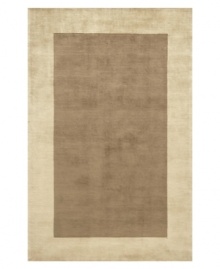 Timeless allure. This attractive area rug illuminates your home with warm mocha-brown color, offset by a refined beige-toned border. Hand-tufted and hand-carved with plush Chinese wool, the rug offers splendid softness and a deep finish that rivals the finest Tibetan weaves. Timeless allure. This attractive area rug illuminates your home with warm mocha-brown color, offset by a refined beige-toned border. Hand-tufted and hand-carved with plush Chinese wool, the rug offers splendid softness and a deep finish that rivals the finest Tibetan weaves.