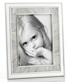 Composed of lustrous silver plate and shimmering mother of pearl, this Martha Stewart Collection picture frame lends opulent grace to beautiful memories. Composed of lustrous silver plate and shimmering mother of pearl, this Martha Stewart Collection picture frame lends opulent grace to beautiful memories.