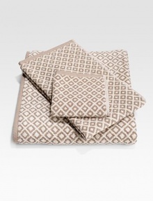 Inspired by the hammered texture on a samurai's sword handle, this woven dimensional square brings a modern texture to the bath. 7 X 12 Fine, long-staple cotton Machine wash Imported 