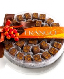 Fall into a world of decadence with these classic milk chocolate mint candies from Frango. Each gourmet chocolate piece is specially painted with a festive autumn leaf motif, making this box ripe for the giving. Fall into a world of decadence with these classic milk chocolate mint candies from Frango. Each gourmet chocolate piece is specially painted with a festive autumn leaf motif, making this box ripe for the giving.