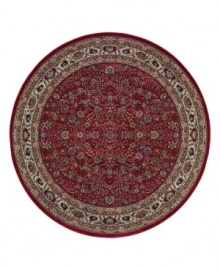 Inspired by the lovely Sarouk carpets of ancient Persia, this round rug features an intricate floral motif in ivory, sage green and accents of soft blue against a rich red ground. Inspired by the lovely Sarouk carpets of ancient Persia, this round rug features an intricate floral motif in ivory, sage green and accents of soft blue against a rich red ground.