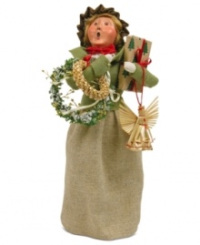 She's got her arms full, but this young woman is thrilled with the unique crafted ornaments destined to go on and under her tree. A great find from Byers' Choice. She's got her arms full, but this young woman is thrilled with the unique crafted ornaments destined to go on and under her tree. A great find from Byers' Choice.