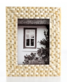 Naturally chic, this Purva picture frame features a thick woven pattern in pure bone, elevating decor with unconventional style and rich texture. Naturally chic, this Purva picture frame features a thick woven pattern in pure bone, elevating decor with unconventional style and rich texture.