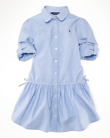 A classic, essential cotton oxford shirtdress is finished with iconic embroidery and a drawstring waist for a preppy look.