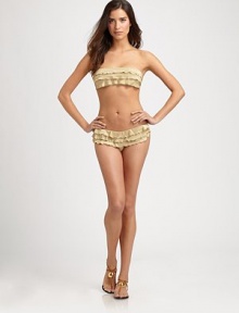 It has shimmer. It has ruffles. It has just the right amount of coverage. It's perfect.Stretch comfortFully lined44% nylon/44% polyester/12% spandexHand washImportedPlease note: Bikini top sold separately. 