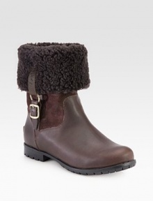 Stay warm wearing this shearling-lined boot made of rich leather and suede with buckled goldtone hardware. Rubber heel, 1 (25mm)Shaft, 11Leg circumference, 13Leather, suede and shearling upperPull-on style with leather adjustable buckle strapShearling liningRubber trek solePadded insoleImported