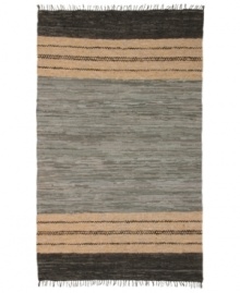 Olé! Spice up your decor with the gorgeously festive style of the Matador rug from St. Croix. Durable leather strips in elegant grey and cream hues are meticulously hand woven with fine cotton strands, resulting in a beautiful, rustic texture and natural braided pattern that accents even the most eclectic decor.