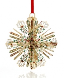A burst of holiday brilliance, this radiant snowflake ornaments your tree with intricate spokes of gold-plated brass and flourishes of red, white and green. With 2012 hangtag. A burst of holiday brilliance, this radiant snowflake ornaments your tree with intricate spokes of gold-plated brass and flourishes of red, white and green. With 2012 hangtag.