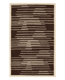 Light and dark tones of brown and beige collide to produce this dynamic piece, designed by Surya's world-renowned artisans. Transforming any decor from static to stirring, the Studio Rowe area rug uses hand-tufted New Zealand wool to create an ultra-soft surface that lasts in the most high-traffic environments. Light and dark tones of brown and beige collide to produce this dynamic piece, designed by Surya's world-renowned artisans. Transforming any decor from static to stirring, the Studio Rowe area rug uses hand-tufted New Zealand wool to create an ultra-soft surface that lasts in the most high-traffic environments.