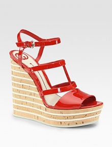 Glossy, adjustable patent leather straps, elevated by a cork and foam wedge. Cork and foam wedge, 5 (125mm)Covered platform, 1½ (40mm)Compares to a 3½ heel (90mm)Patent leather upperLeather liningRubber solePadded insoleMade in ItalyOUR FIT MODEL RECOMMENDS ordering one half size up as this style runs small. Glossy, adjustable patent leather straps, elevated by a cork and foam wedge. Cork and foam wedge, 5 (125mm)Covered platform, 1½ (40mm)Compares to a 3½ heel (90mm)Patent leather upperLeather liningRubber solePadded insoleMade in ItalyOUR FIT MODEL RECOMMENDS ordering one half size up as this style runs small.