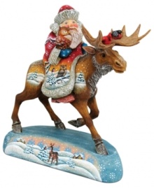 Santa forgoes the comfort of his sleigh for a moose in this elaborate figurine from DeBrekht. The sights he sees are echoed in beautiful scenes hand painted on the animal and stand below. Santa forgoes the comfort of his sleigh for a moose in this elaborate figurine from DeBrekht. The sights he sees are echoed in beautiful scenes hand painted on the animal and stand below.