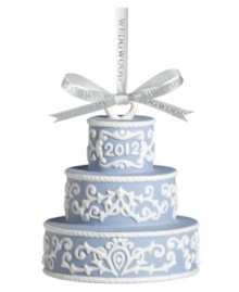 Two celebrations in one. Three tiers of powder-blue Wedgwood porcelain decked in scrolling white make this Our First Christmas cake ornament a must for newlyweds – and a cute wedding gift! Two celebrations in one. Three tiers of powder-blue Wedgwood porcelain decked in scrolling white make this Our First Christmas cake ornament a must for newlyweds – and a cute wedding gift!